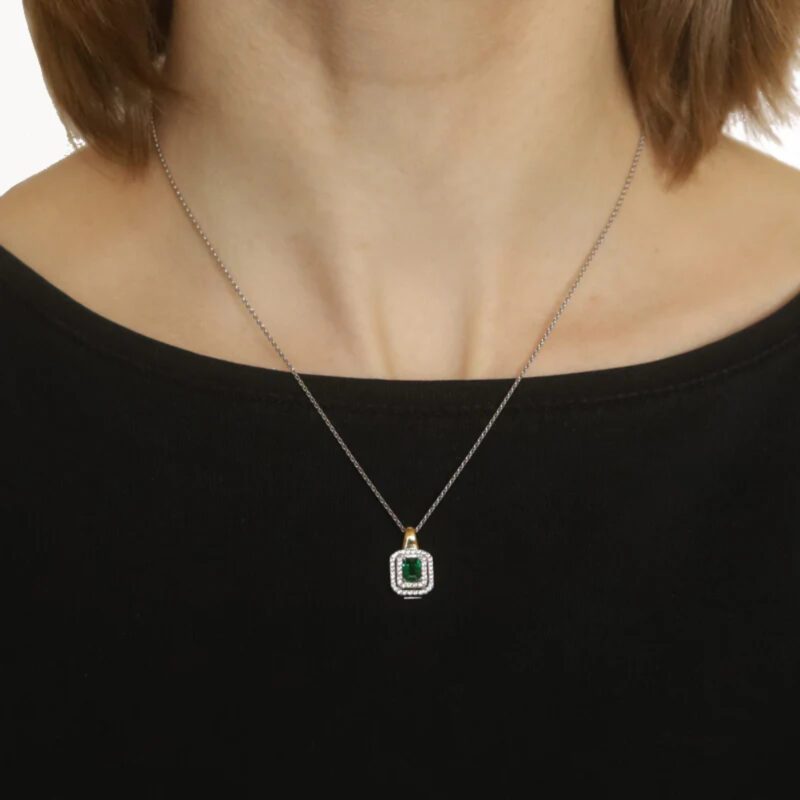 0.55 Carat Emerald and Diamond Halo Pendant in Gold