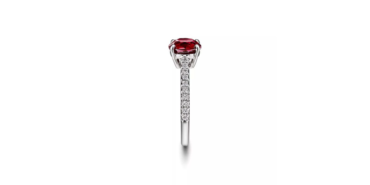 a close up of a Tiffany Novo Ruby ring on a table.