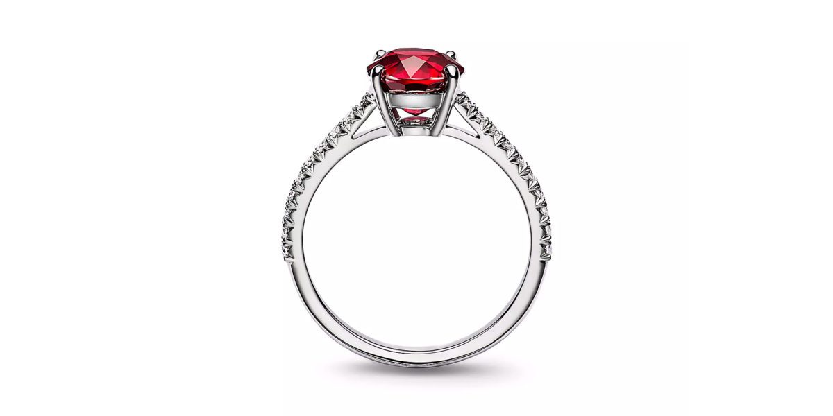 a close up of a Tiffany Novo Ruby ring on a table.