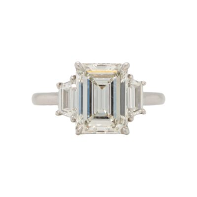Three-Stone Collection - Emerald-cut Diamond with Trapezoid Side Stones in Platinum