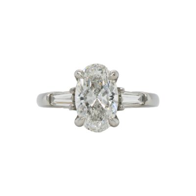 Three-Stone Collection - Oval-cut Diamond with Baguette Side Stones in Platinum